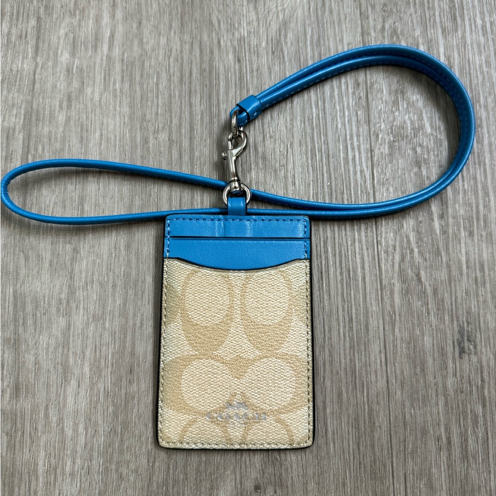 Coach signature coated canvas with leather details. Light brown (tan)/sky blue.